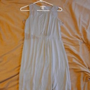 I'm selling a gray dress its soft in good condition brand design history